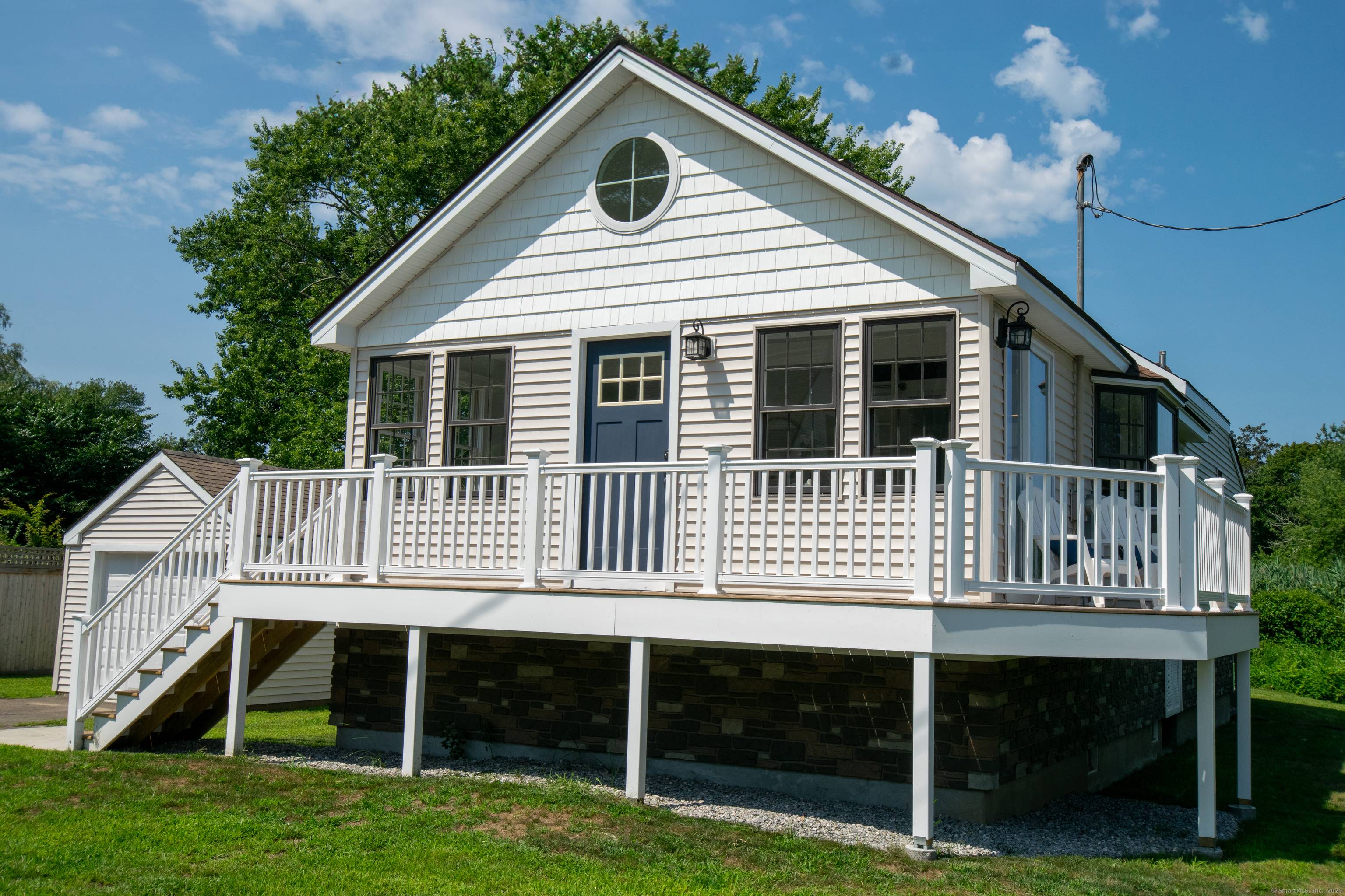 This FEMA compliant coastal residence in Old Saybrook offers panoramic views of South Cove at the mouth of the Connecticut River, where the river meets the sound.