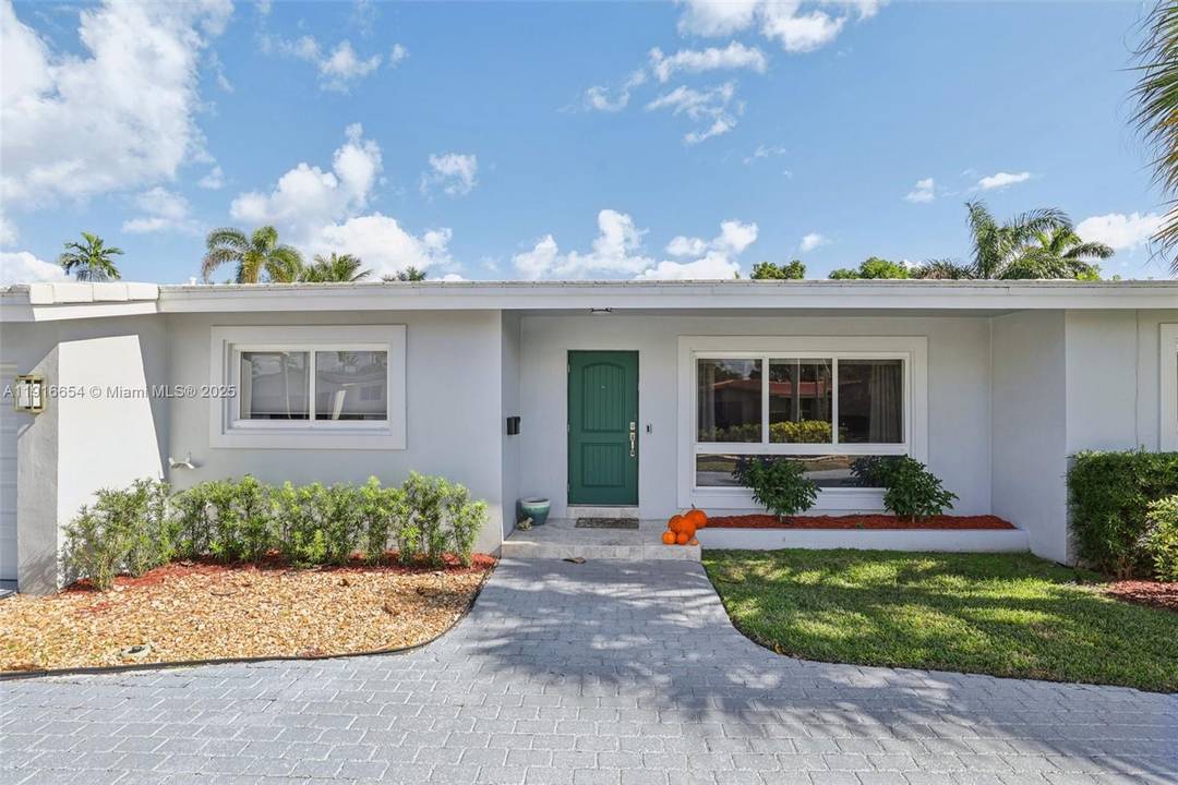 Move in ready Coral Ridge home with permitted upgrades and exceptional indoor outdoor flow.