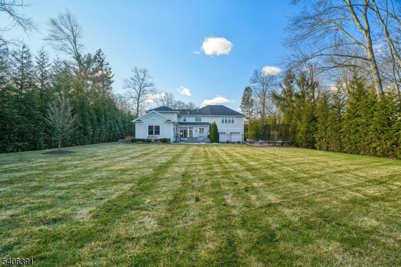 STUNNING CUSTOM COLONIAL, PREMIER SHORT HILLS LOCATION Completely renovated from top to bottom in 2021, this mint condition 5BR, 4.