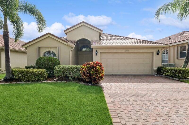 Step into this inviting open concept home with vaulted ceilings and beautiful timeless marble tile floors laid out on the diagonal.