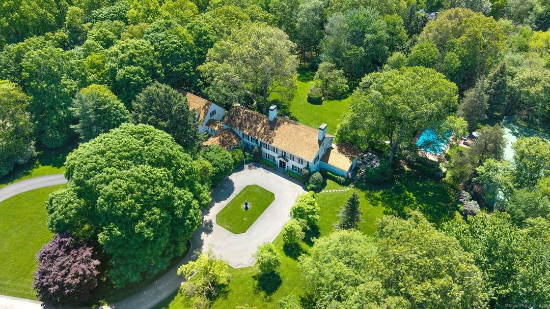 Nestled in one of Connecticut's most sought after estate neighborhoods and just minutes from town, this spectacular 1939 Classic Colonial blends timeless elegance with every modern amenity.