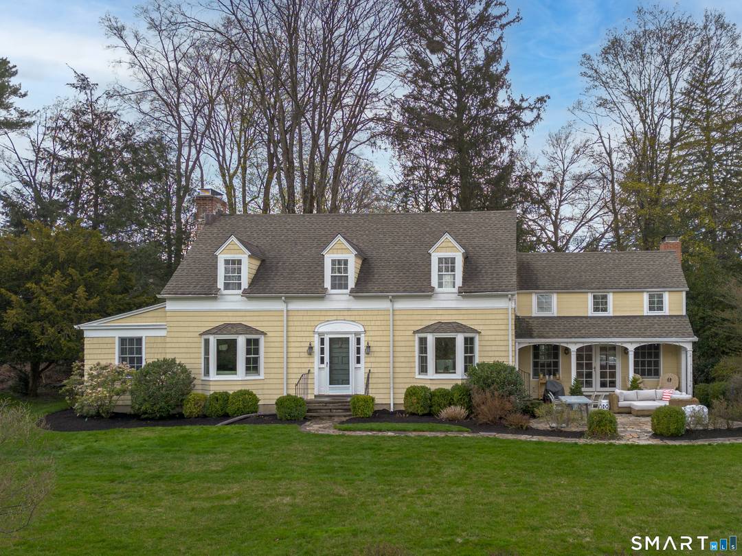 Set on nearly two acres of beautifully landscaped, park like grounds, this enchanting 1930s Colonial is tucked away on a private cul de sac just moments from the village and ...