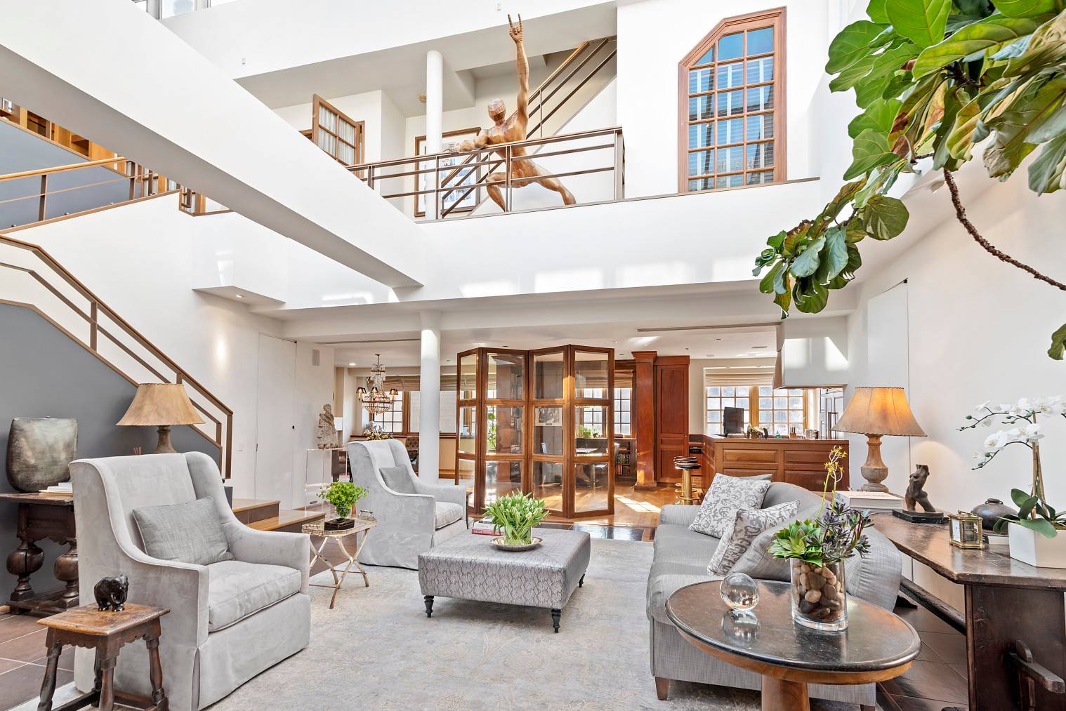 East Village penthouse spanning 6400sf interior and an additional 725sf of terraces combines the building top floor 7AB with its two terraces and 24ft ceiling skylight with the 1500sf guest ...