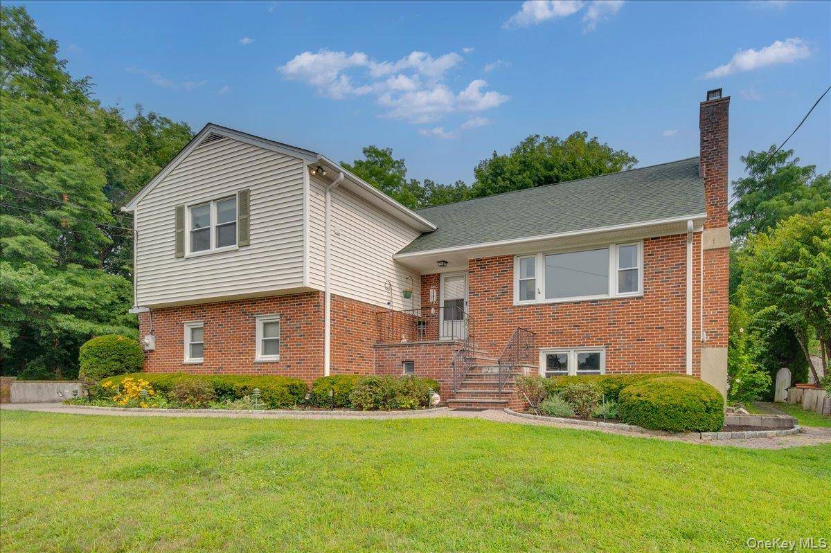 Proudly perched atop 22 Shelton Street, this classic split level home makes a lasting impression with its timeless architecture, solid construction, and elevated setting in one of Harrison s desirable ...