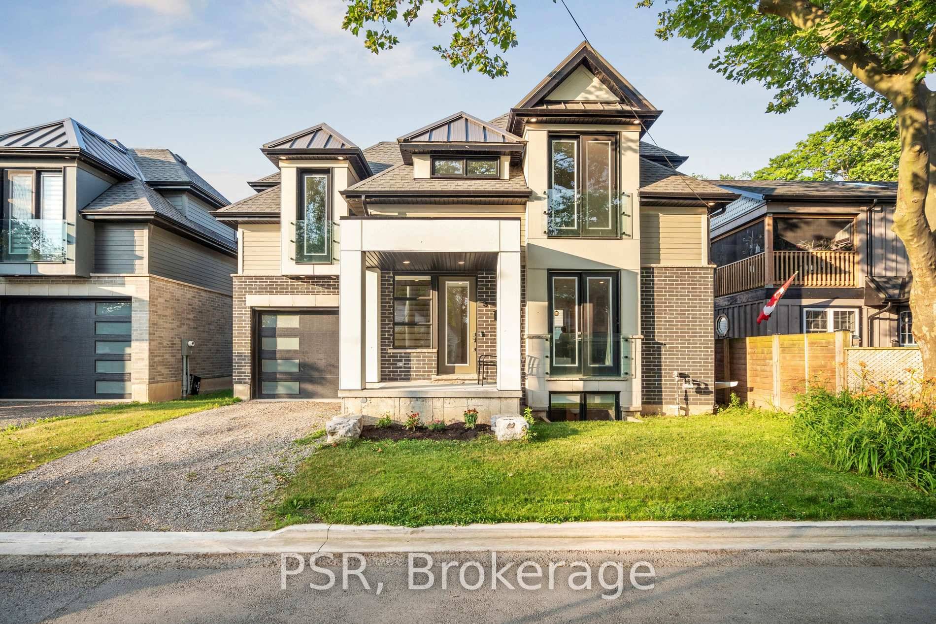 Discover your ideal coastal retreat tucked away on a peaceful, private laneway just steps from Lake Ontario.