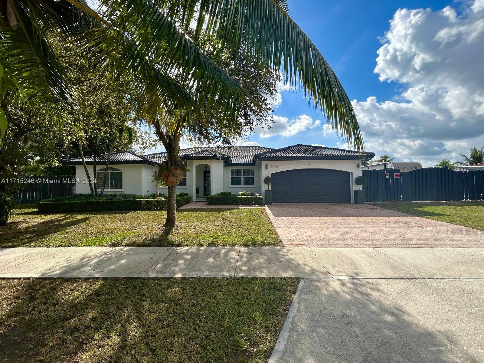 Breathtaking 4 bed 3 bath home in West Kendall facing the ENORMOUS and PEACEFUL Chuck Pezoldt Park PERFECT for families or exercise junkies !