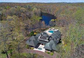 Featured in Architectural Digest and designed by Taliesin graduate John Gillis, this remarkable 5 bedroom, 5 full 2 half bath modern home suggests a Prairie style village of adjoining rooms ...