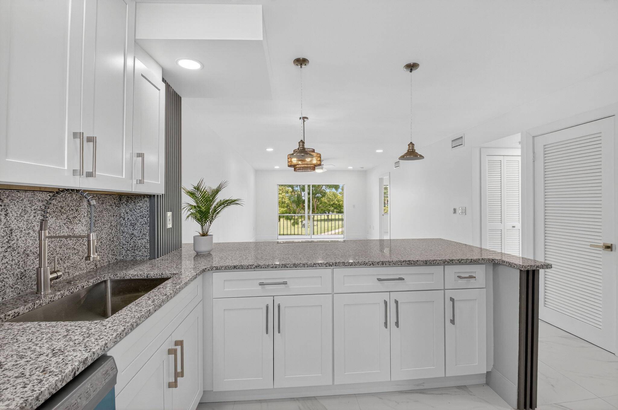 Seller offers OWNER FINANCING for this Magnificently updated 2 bedroom, 2 bath unit in well maintained 55 community overlooking the garden beyond.