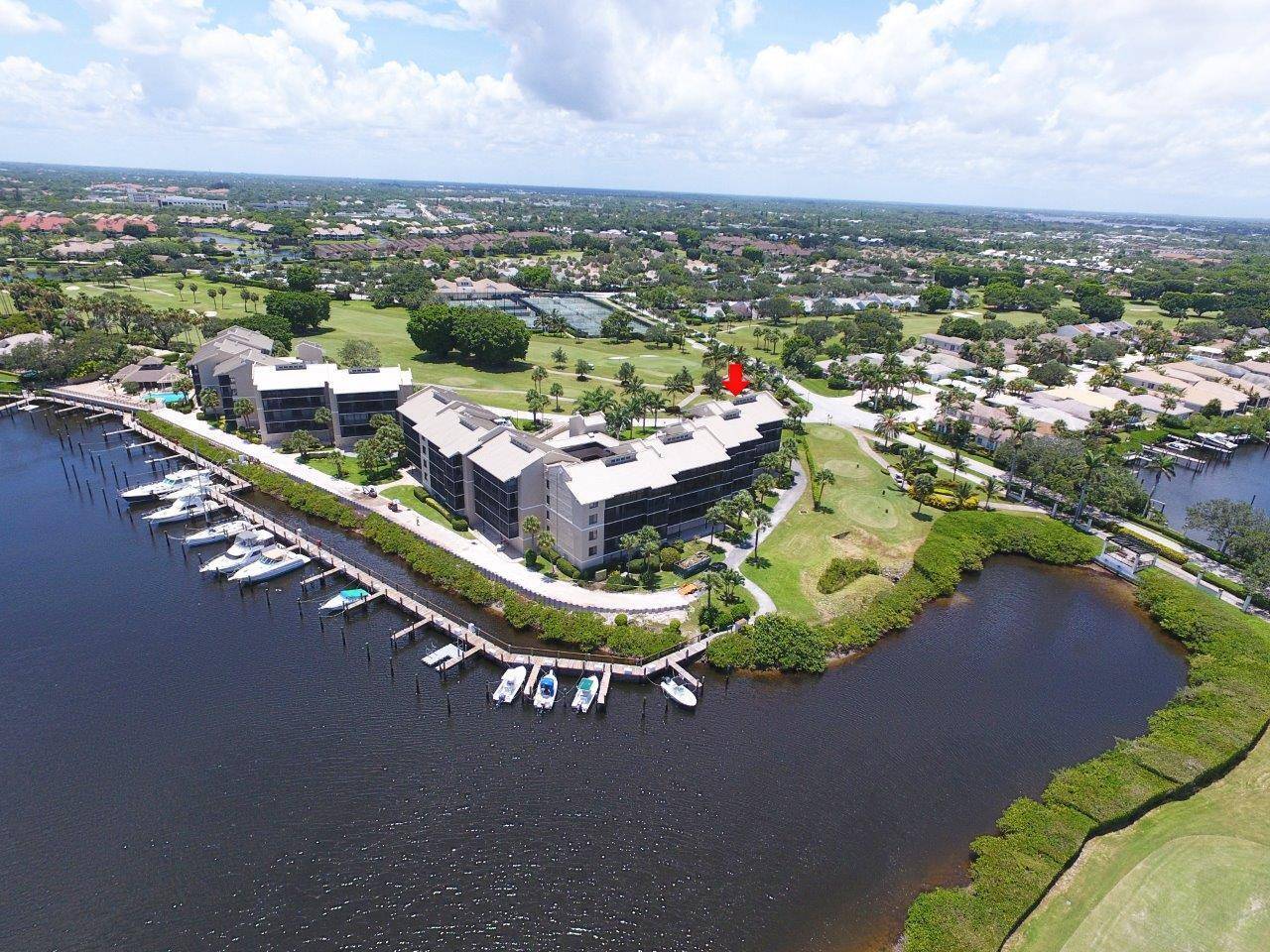Waterfront 2BD 2BA condo in prestigious Jonathan's Landing with rare 40 ft screened balcony overlooking lagoon and golf course.