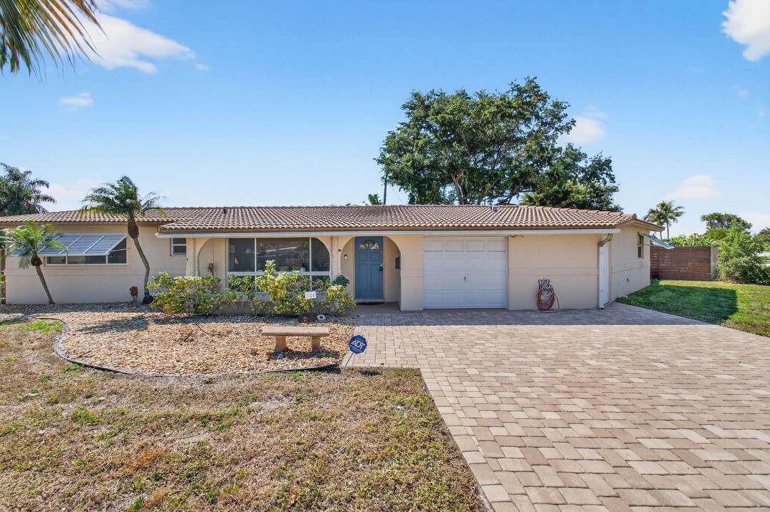 Welcome to this exceptional East Deerfield Beach residence, ideally positioned on an oversized corner lot in a highly desirable non HOA neighborhood just a half mile from the beach.