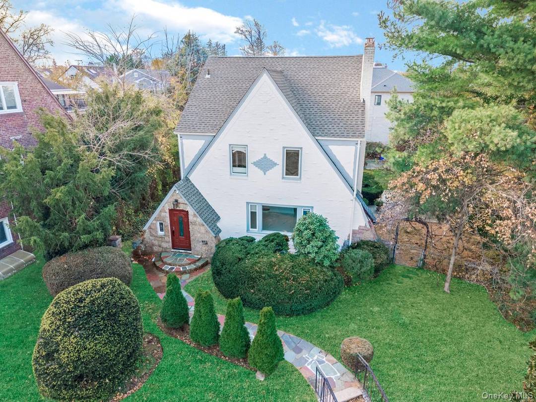 Bright and updated all brick Tudor home in fabulous location within short distance to schools, shopping and public transportation.
