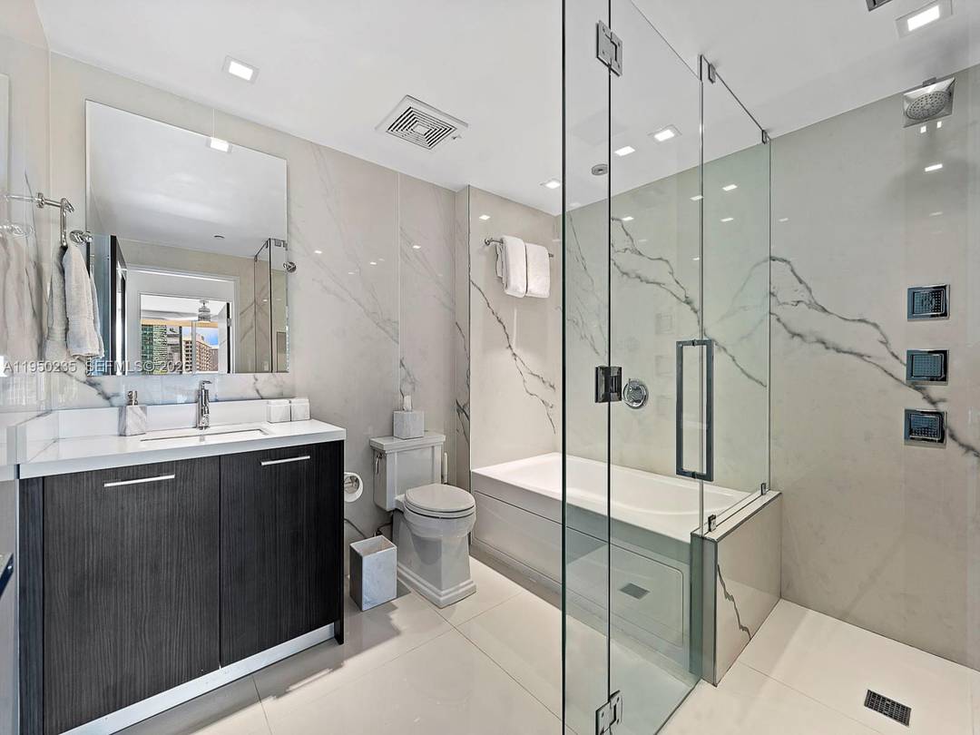 75, 000 in Upgrades. Turnkey luxury, designer remodeled 1 Bedroom in 500 Brickell East NO ASSESSMENTS.