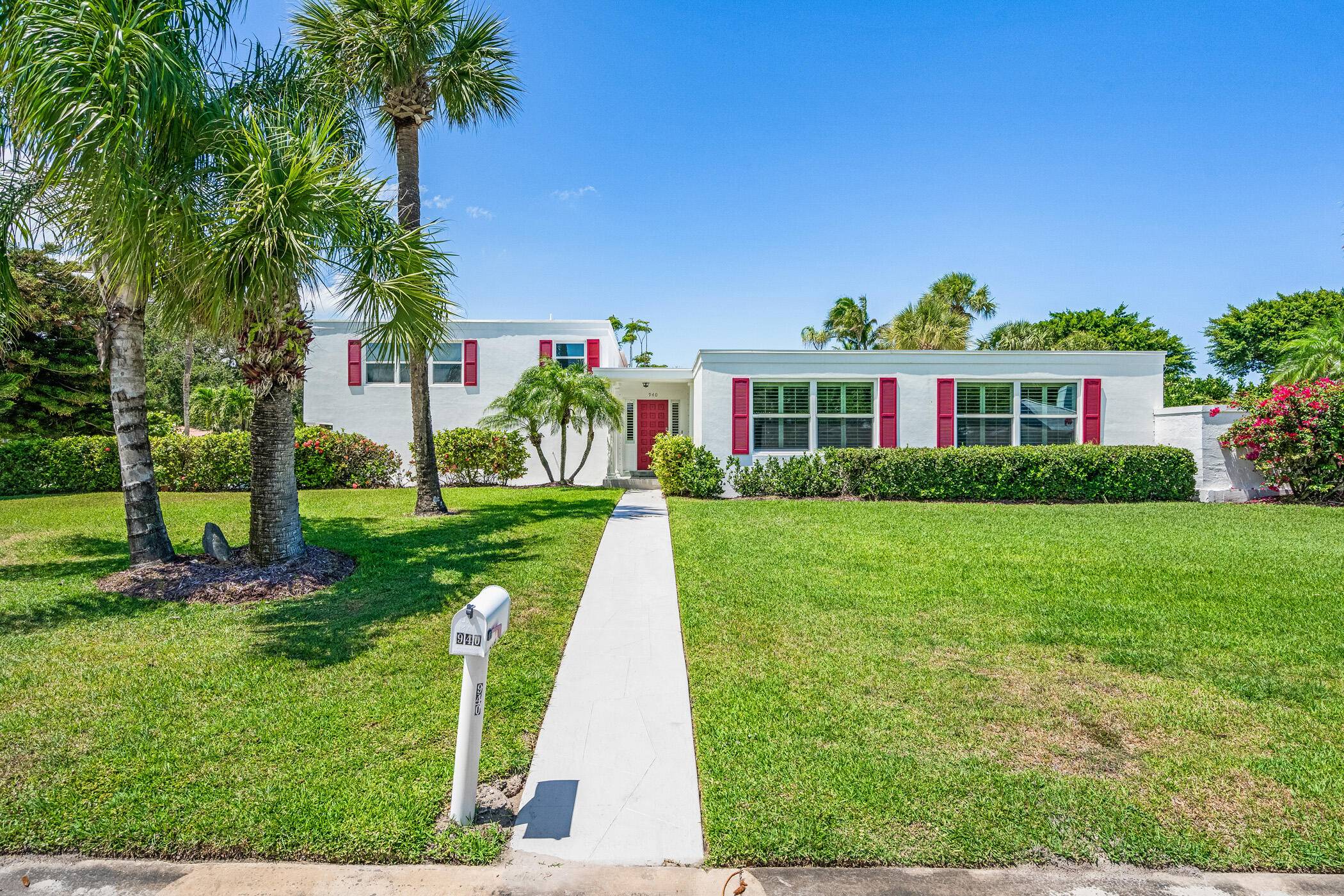 Just a block from the Moorings' private beach, this 4BR 5BA mid century gem sits on a high corner lot, offering rare privacy and endless potential.