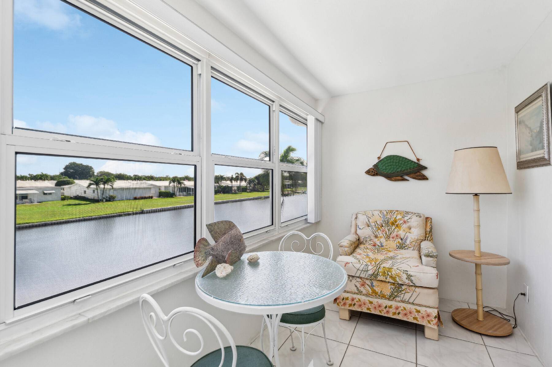 Spectacular water views from this totally updated CORNER 2Br 2Ba with glass enclosed porch.