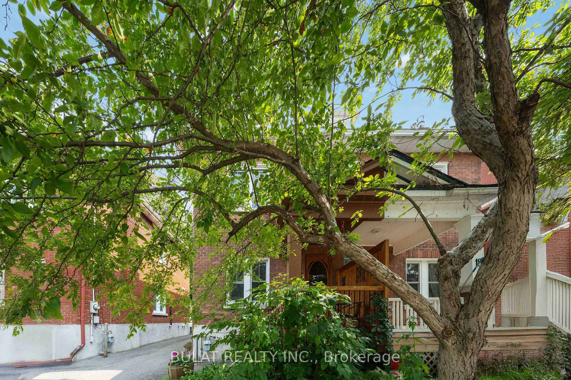 Nestled on a tree lined street in trendy Hintonburg, this charming full brick semi detached home offers timeless character, spacious living, and major structural improvements.