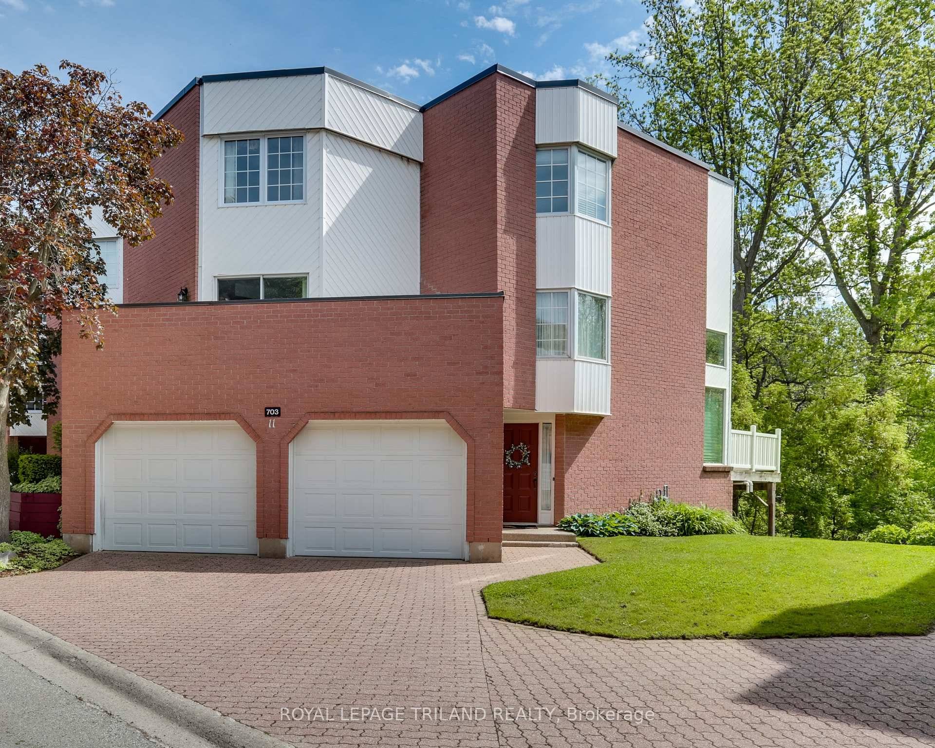 Luxurious End Unit Condo with Spectacular Green Views and Exceptional Design.