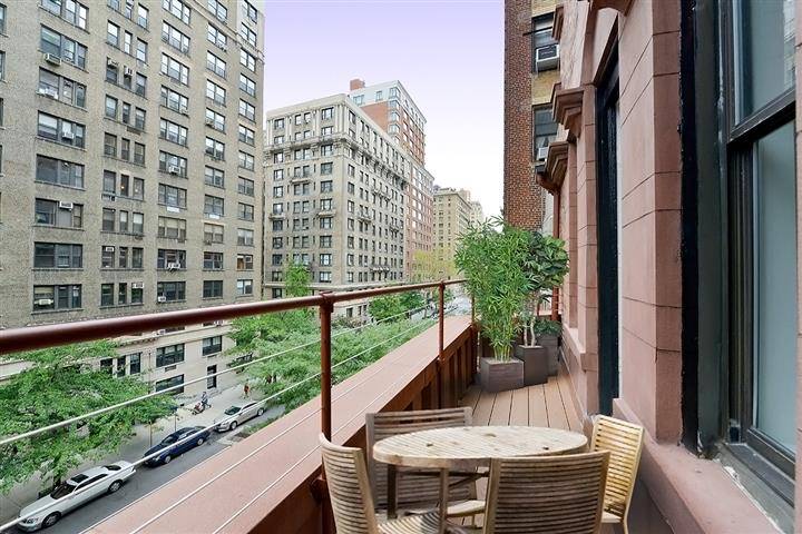 Beautiful Prewar 1 bedroom apartment with an outdoor balcony and decorative fireplace.