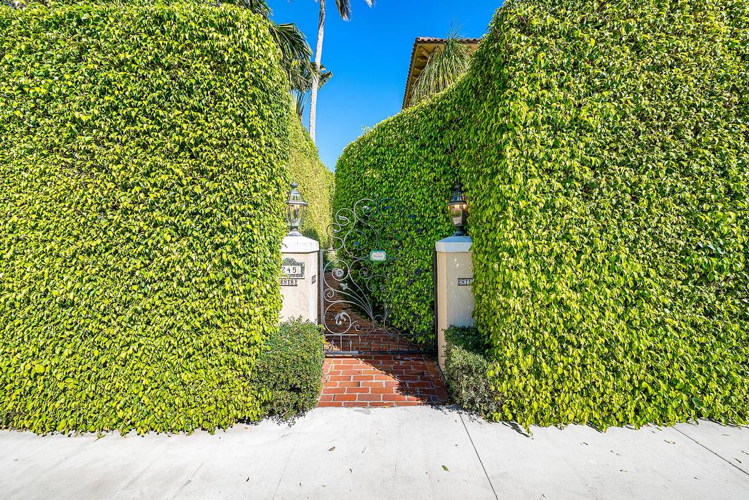 Quintessential Palm Beach Living tucked behind the hedges in a coveted island setting.