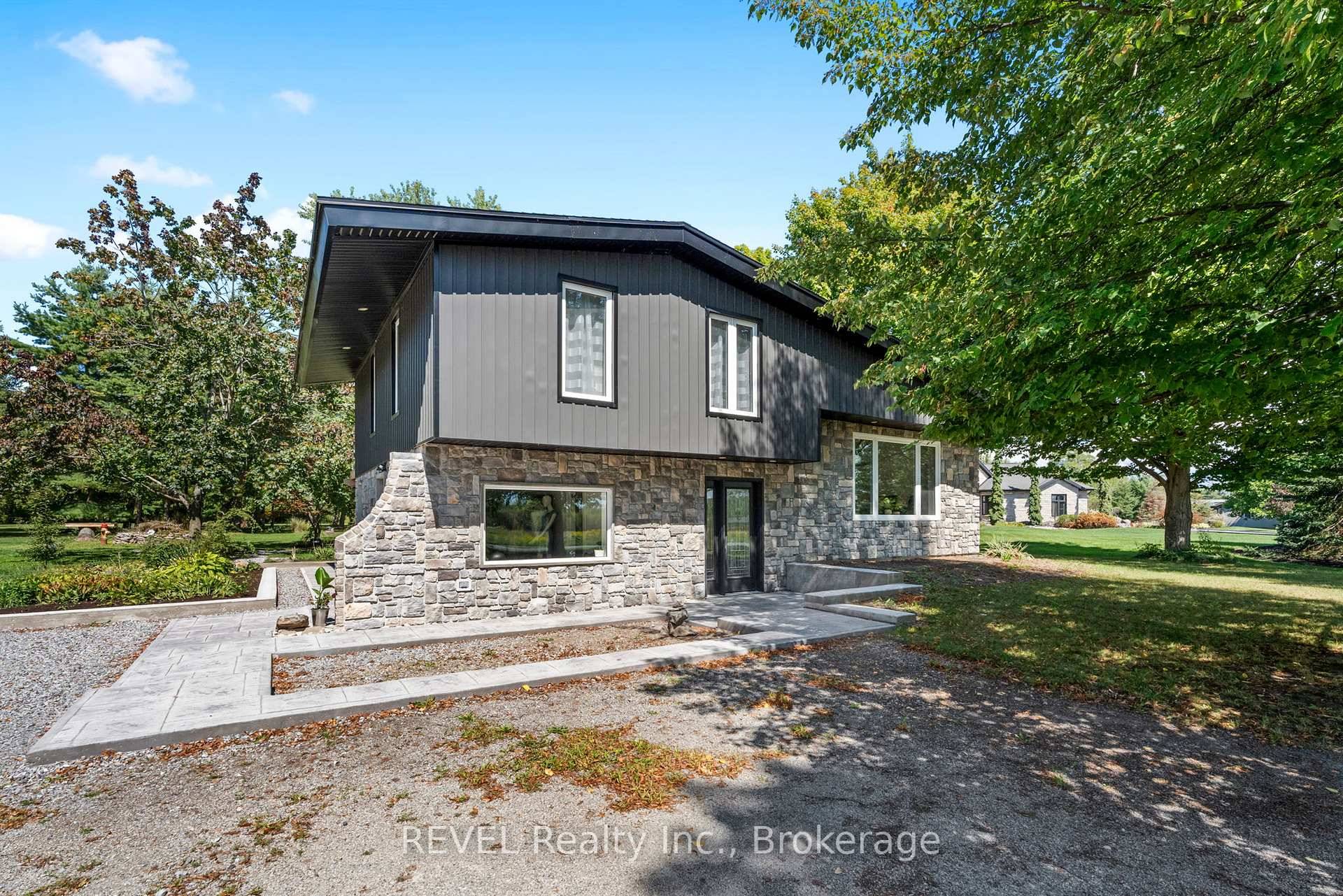 Nestled on nearly 2 acres with a mature tree lined lot, this beautiful contemporary designed home offers a ton of upgrades and space for the entire family ; including a ...