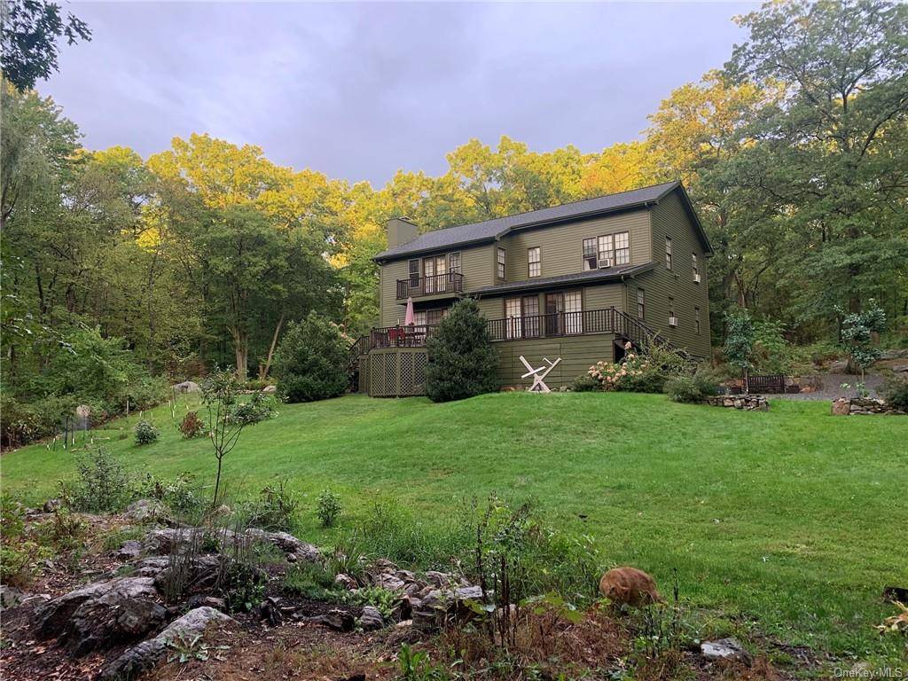 This stunning Colonial home features lovely deck views of a serene pond setting off of a quiet country lane in the heart of Garrison.