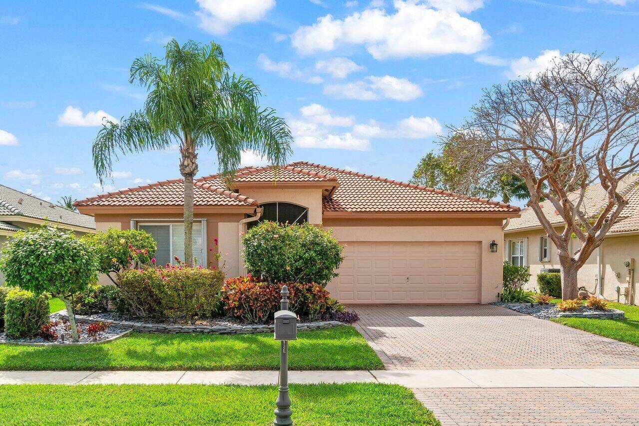 Impeccably maintained 3 bedroom, 2 bath home in the sought after community of Venetian Isles.