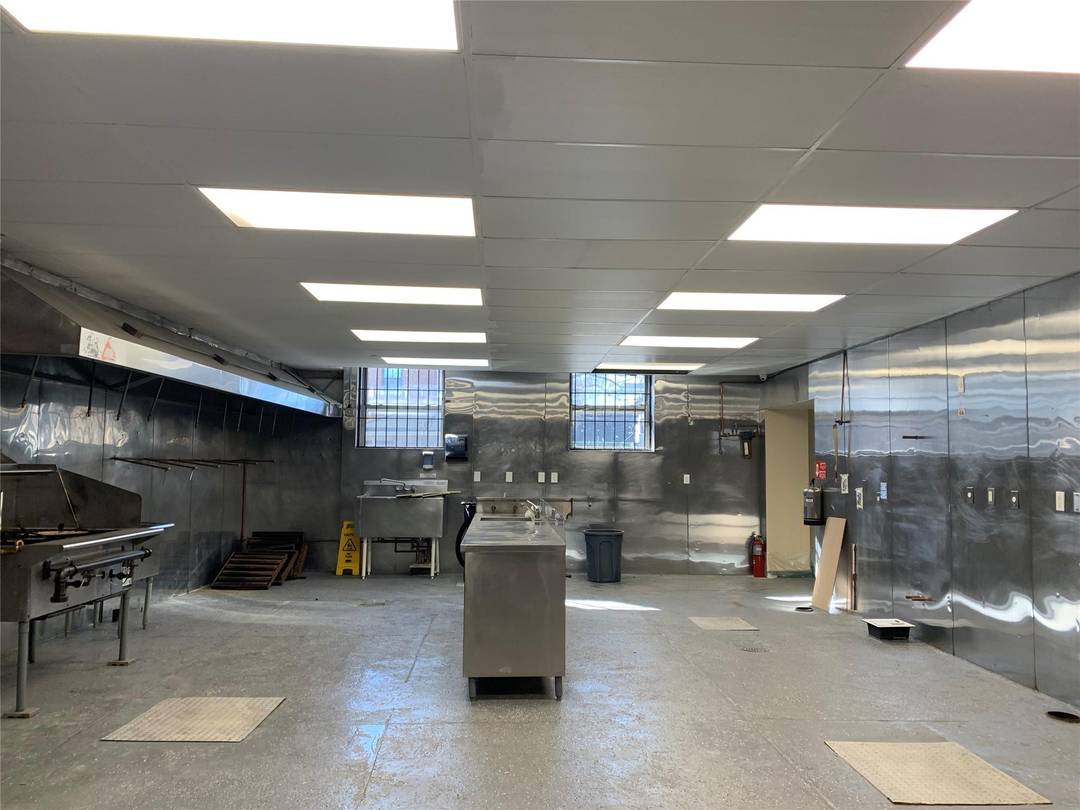 Huge commercial kitchen space with walk in boxes, vented and gas ready.