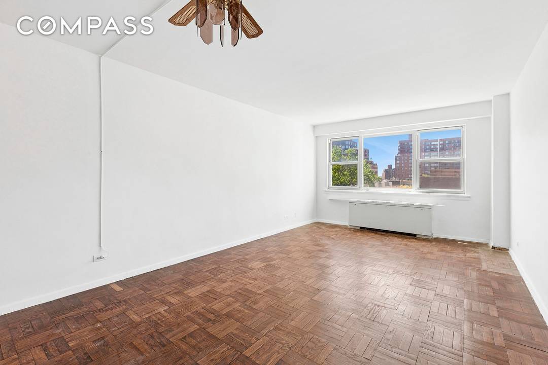 High floor, bright, spacious city view studio at the full service John Adams in the heart of Greenwich Village.