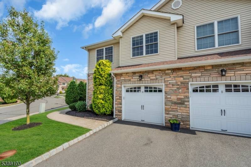 This charming colonial style end unit welcomes you with bright, spacious rooms and an inviting layout ideal for everyday living and entertaining.