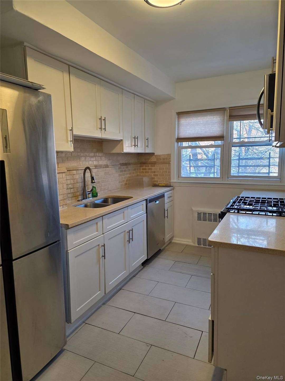 Lovely Brick townhouse in the heart of Kew Garden Hills.
