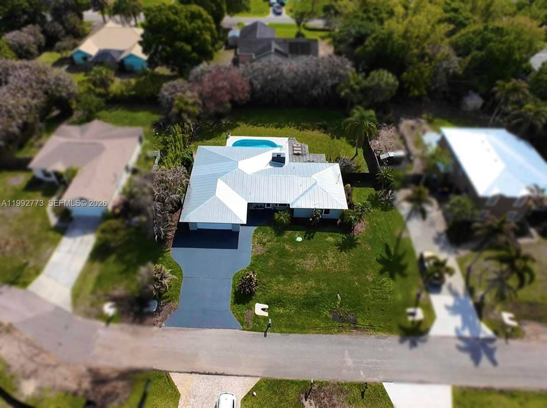 Fully reimagined and impeccably renovated, this 4 bedroom, 2 bath pool home offers 2, 098 square feet of sophisticated living on an expansive 0.