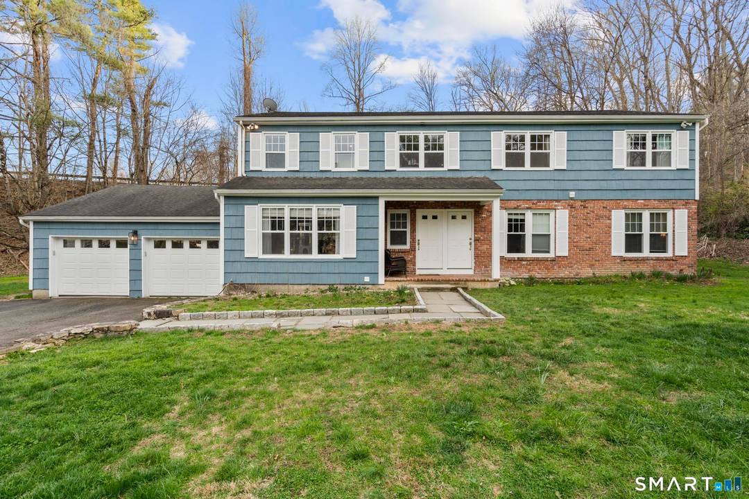 Located on scenic Long Ridge Road in Stamford, this property offers a unique blend of space, flexibility, and natural beauty.