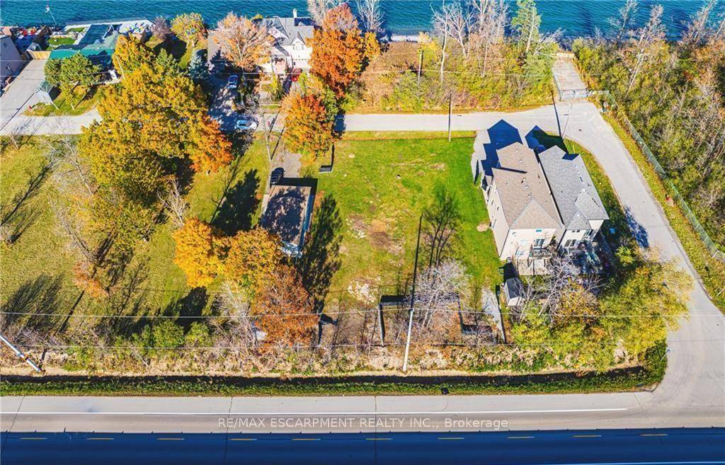 Coveted waterfront community offering rare opportunity to purchase a building lot directly across the road from Lake Ontario.