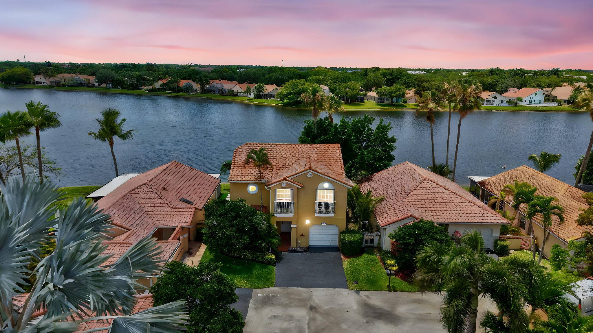 Welcome to your charming 2 story lakefront retreat in Weston's sought after Country Isles Garden Homes at 1388 Garden Rd.