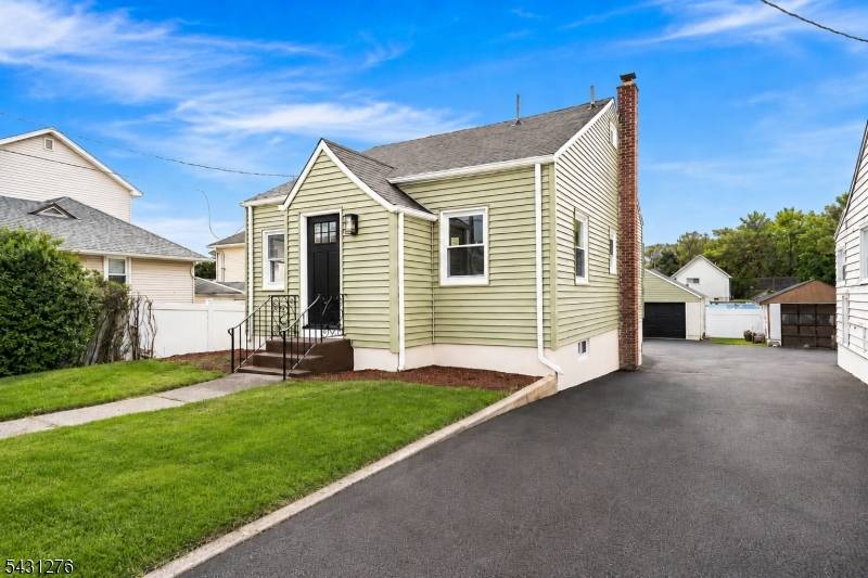Beautifully renovated home featuring new floors, recessed lighting, new windows, new siding, and a bright, modern layout throughout.