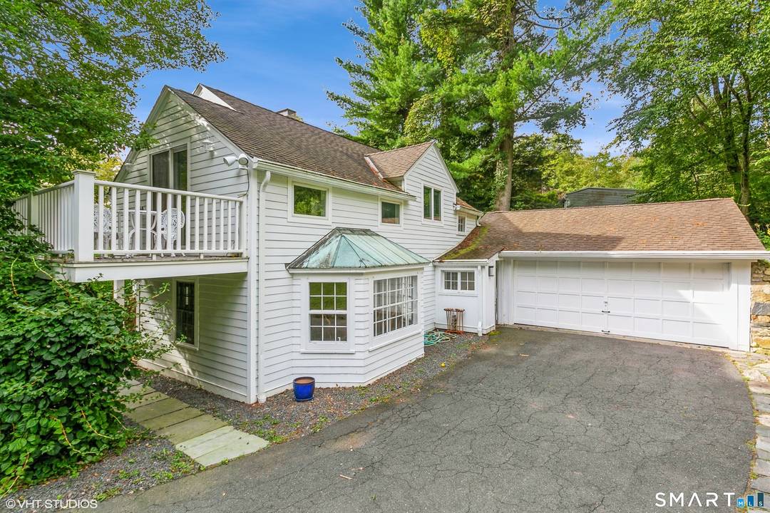 Tucked behind classic New England stone walls and set on nearly three acres of picturesque land, this timeless Redding antique offers a rare blend of charm, privacy, and everyday livability.