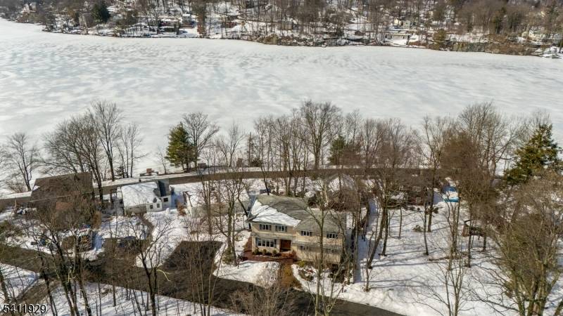 Spectacular Lake Views from nearly every angle in this beautifully positioned home in Upper Greenwood Lake.