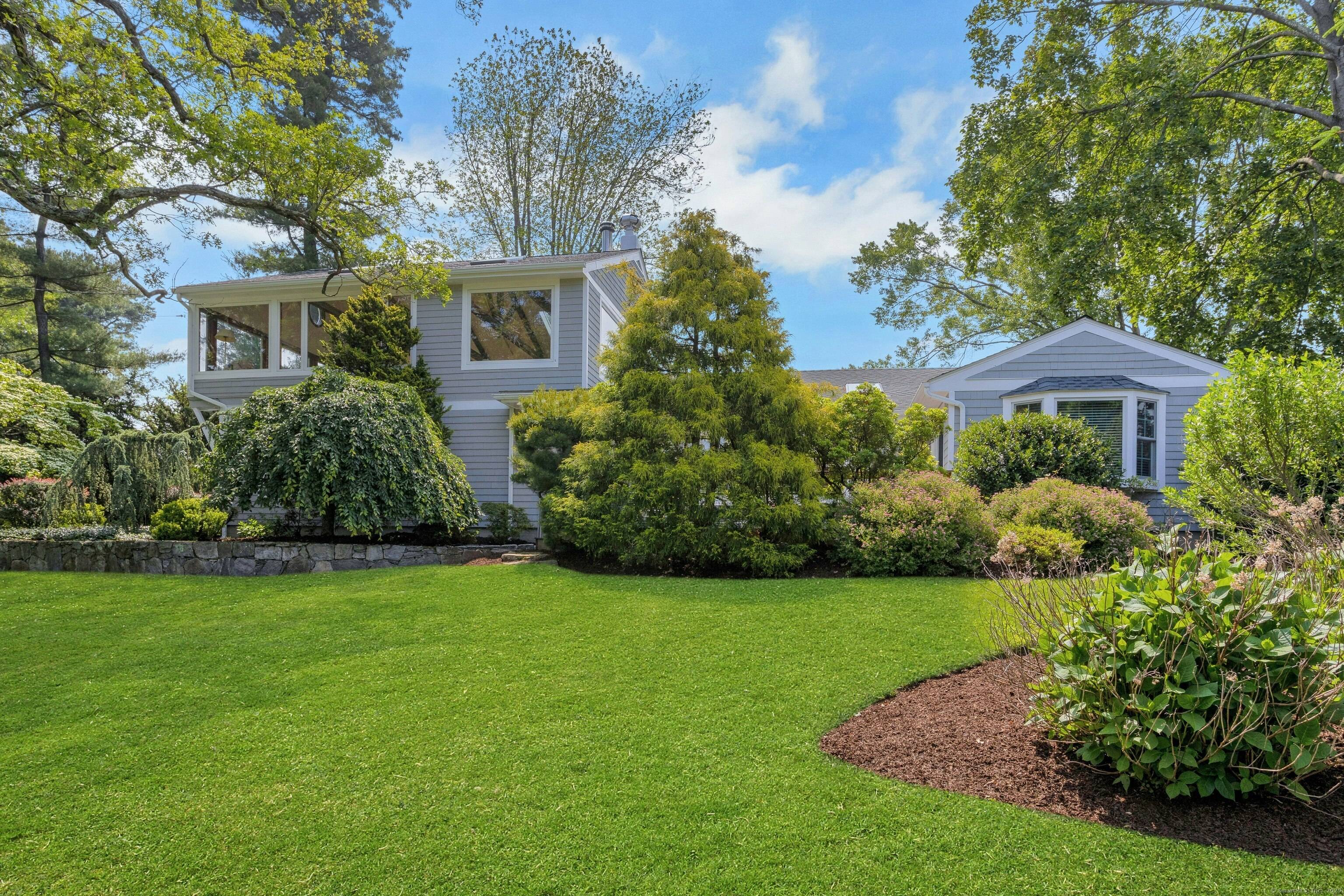 Nestled in the tranquil waterfront community of Saugatuck Shores, this home offers a private escape like no other.