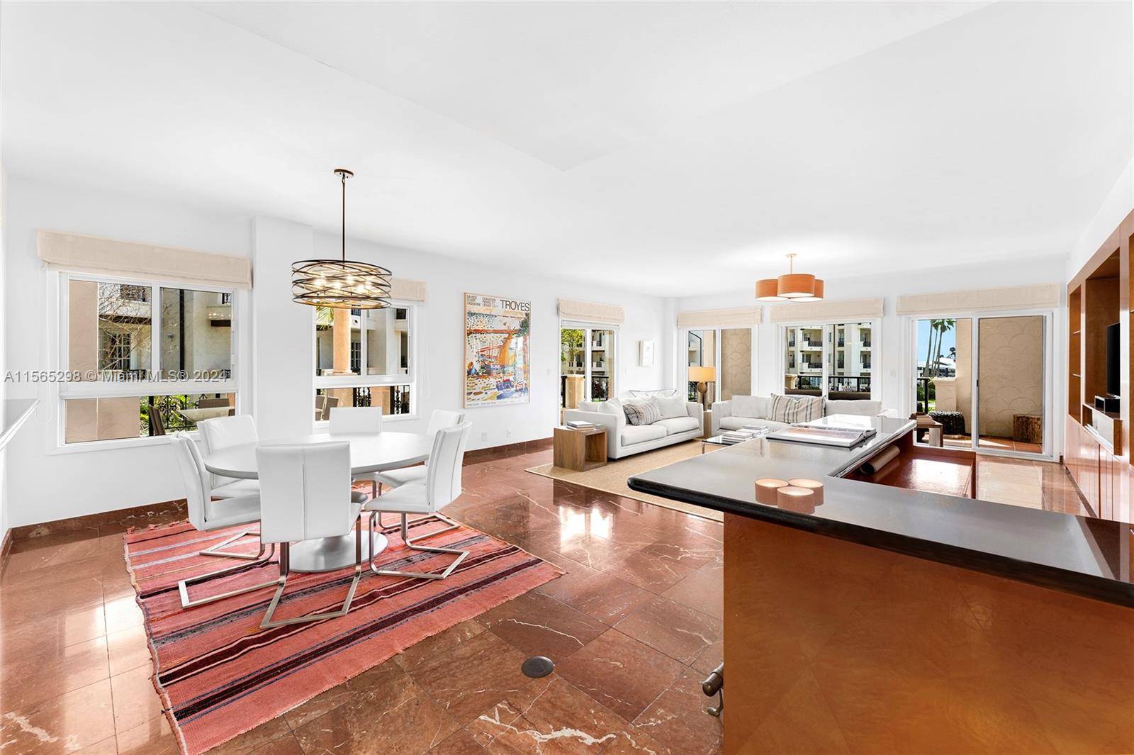 This corner unit at Bayside Village offers breathtaking views of Biscayne Bay, Fisher Island Marina, amp ; the Atlantic Ocean.