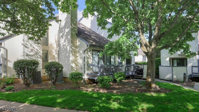 Sought after end unit in the Cedars Development, this bright and airy townhome features 2 bedrooms and 2.
