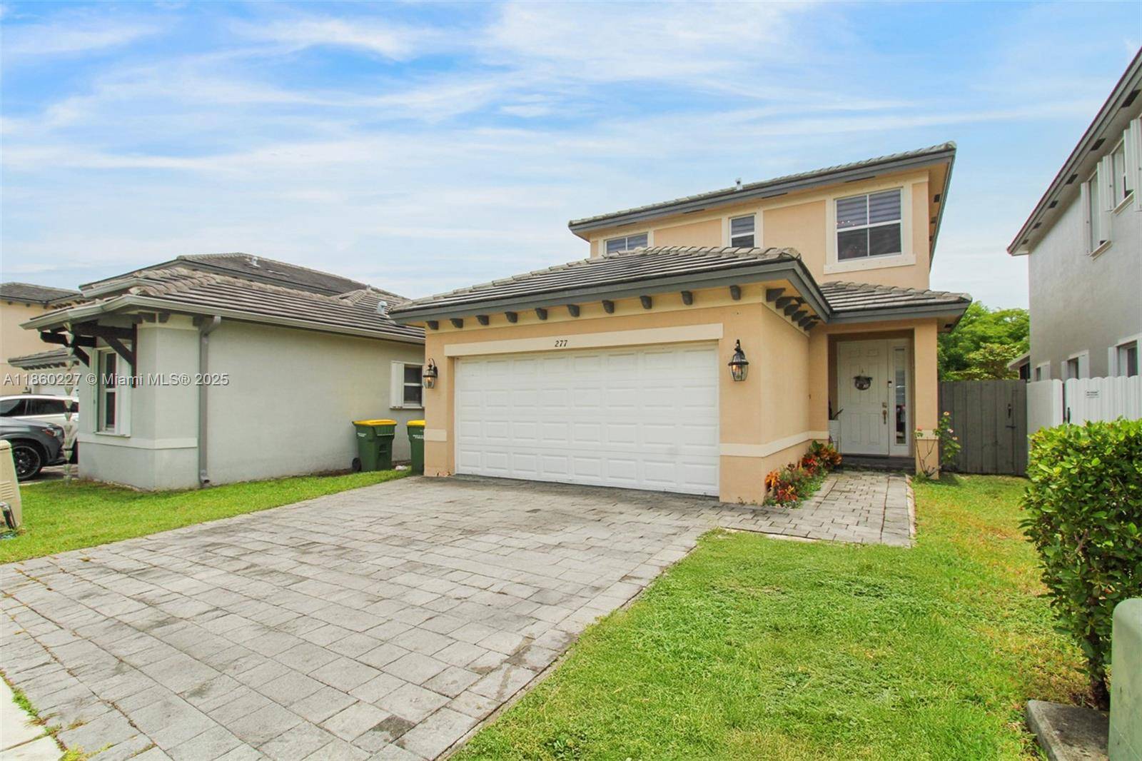 Stunning 5 bedroom, 3 bathroom home in Homestead featuring gleaming porcelain flooring throughout and a spacious open concept layout.