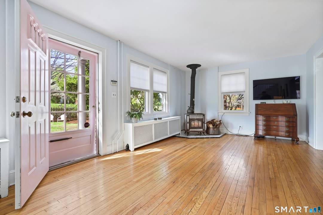 This charming brick and clapboard cape is a fantastic opportunity in a prime location.