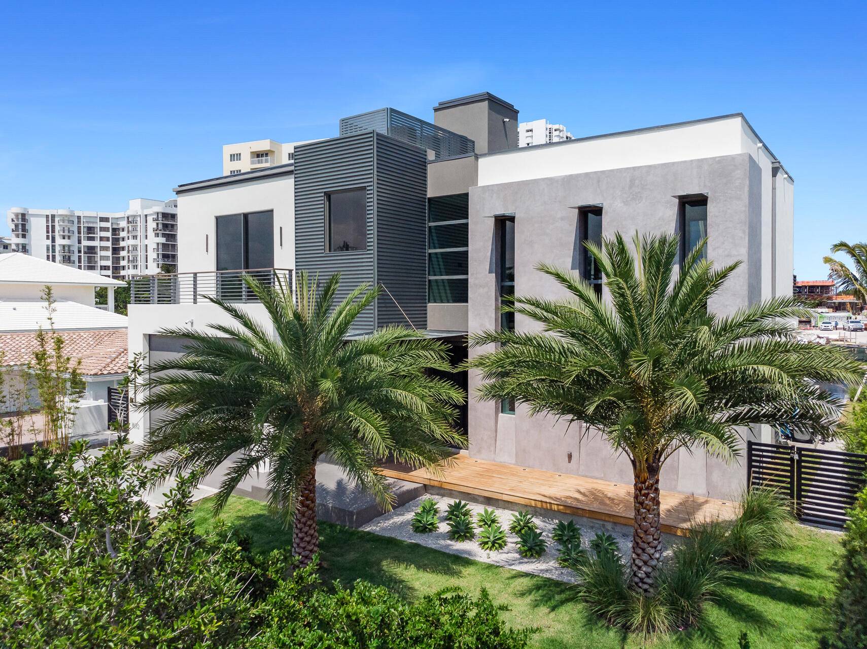 Discover refined living in this stunning modern 5 bedroom, 4 full and 2 half bath waterfront masterpiece located in Lauderdale by the Sea on gated Terra Mar Island.