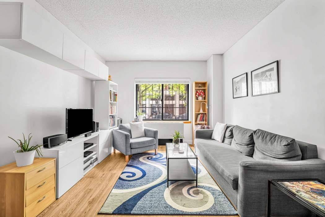 Step into this beautifully renovated one bedroom condo, perched on a raised first floor.