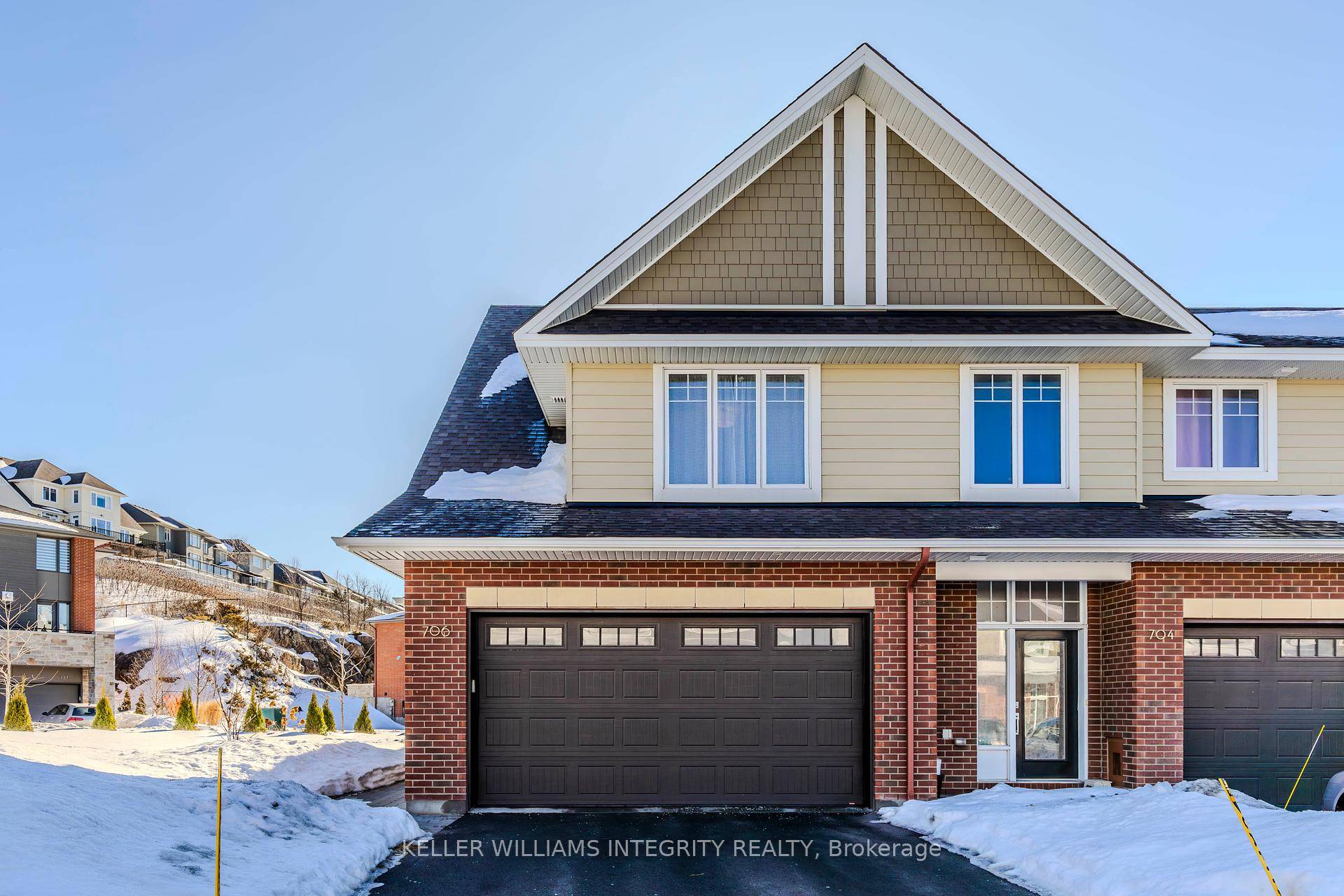 Rarely available Double garage end unit town home gracing an exceeding 4000 sqft premium lot in Kanata's coveted Richardson Ridge.