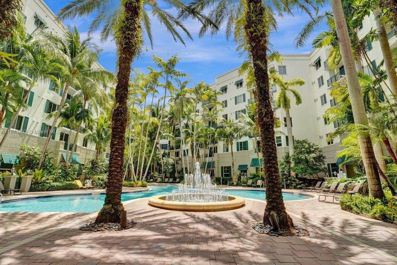 ELEGANT 2 2 Corner condo with elegantly appointed lobby, 2 parking spots, NEW LAMINATE FLOORS THROUGHOUT.