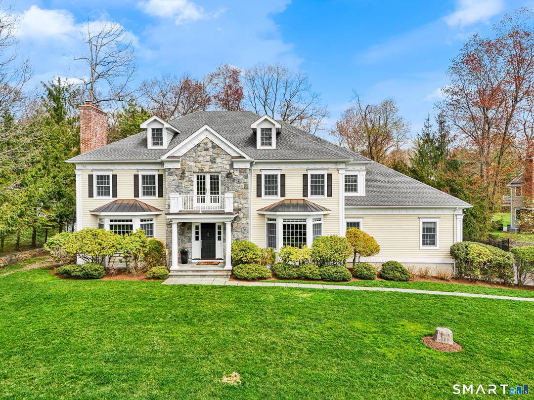 Elegant Colonial set on a private, beautifully landscaped acre in North Stamford.