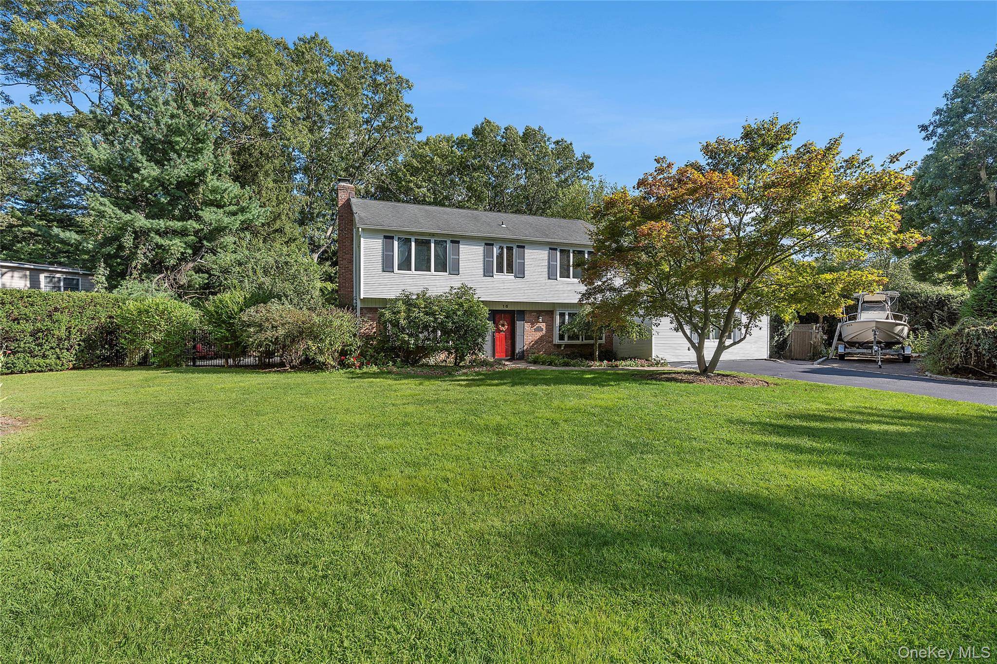 Welcome to 16 Sheppard Lane, a gem nestled in the serene community of Stony Brook.