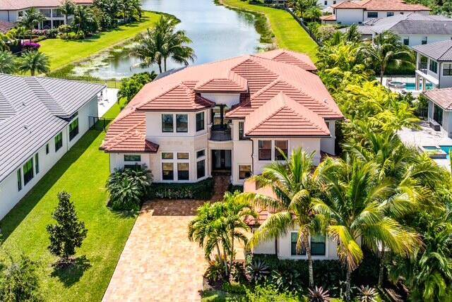 Exquisitely decorated and FULLY FURNISHED by Decorators Unlimited, this highly coveted Colonnade Grande floor plan is perfectly perched at the head of a long lake in Seven Bridges.