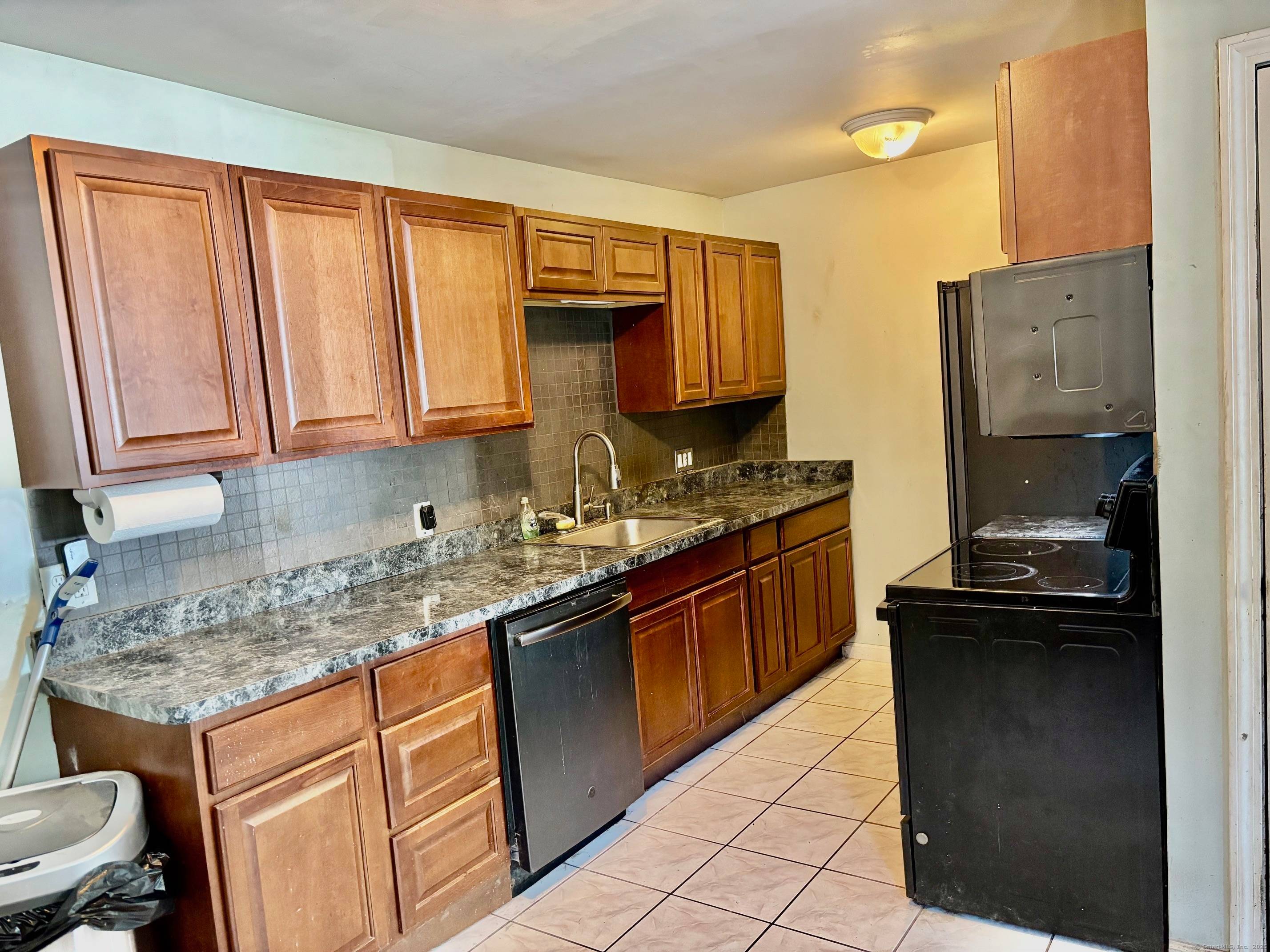 Here's your chance to own a beautifully expanded 4 bedroom, 2 bath Cape in one of Bethel's finest neighborhoods.