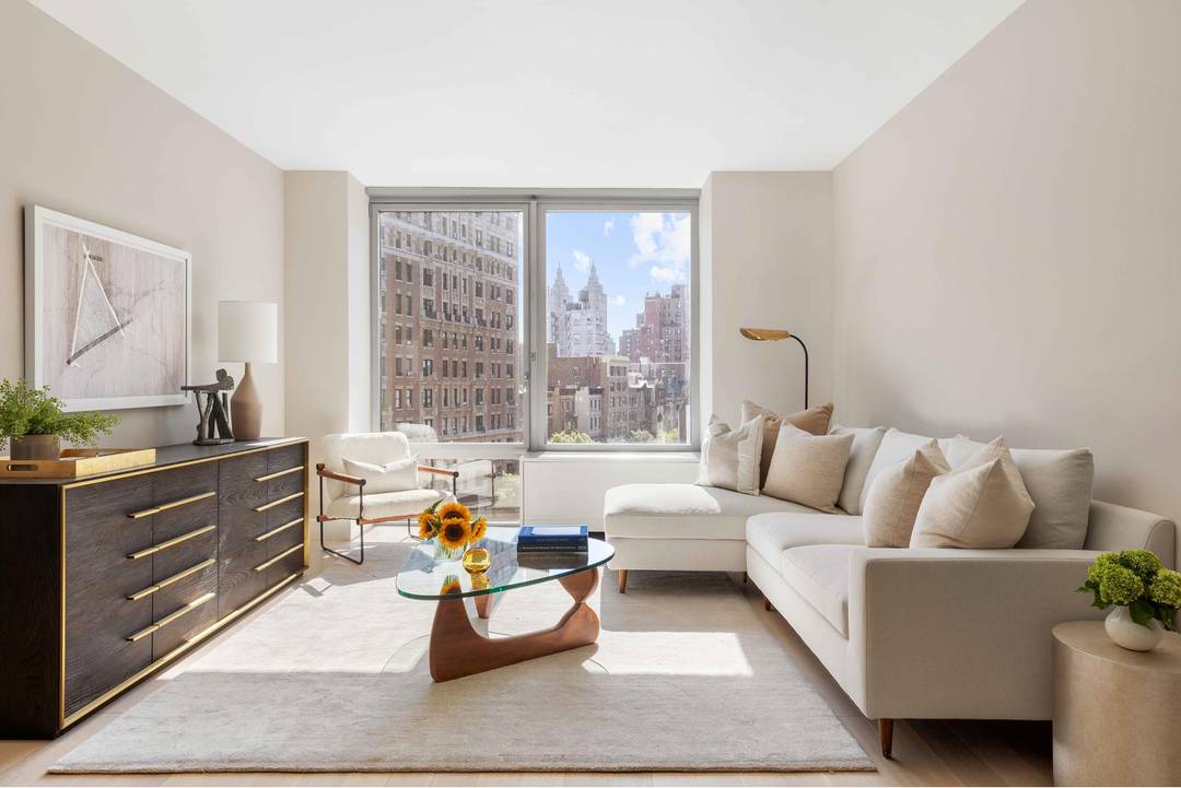 This gracious 1, 694 square foot, three bedroom, two and a half bath residence features 10 foot ceilings and opens onto five inch white oak plank floors.